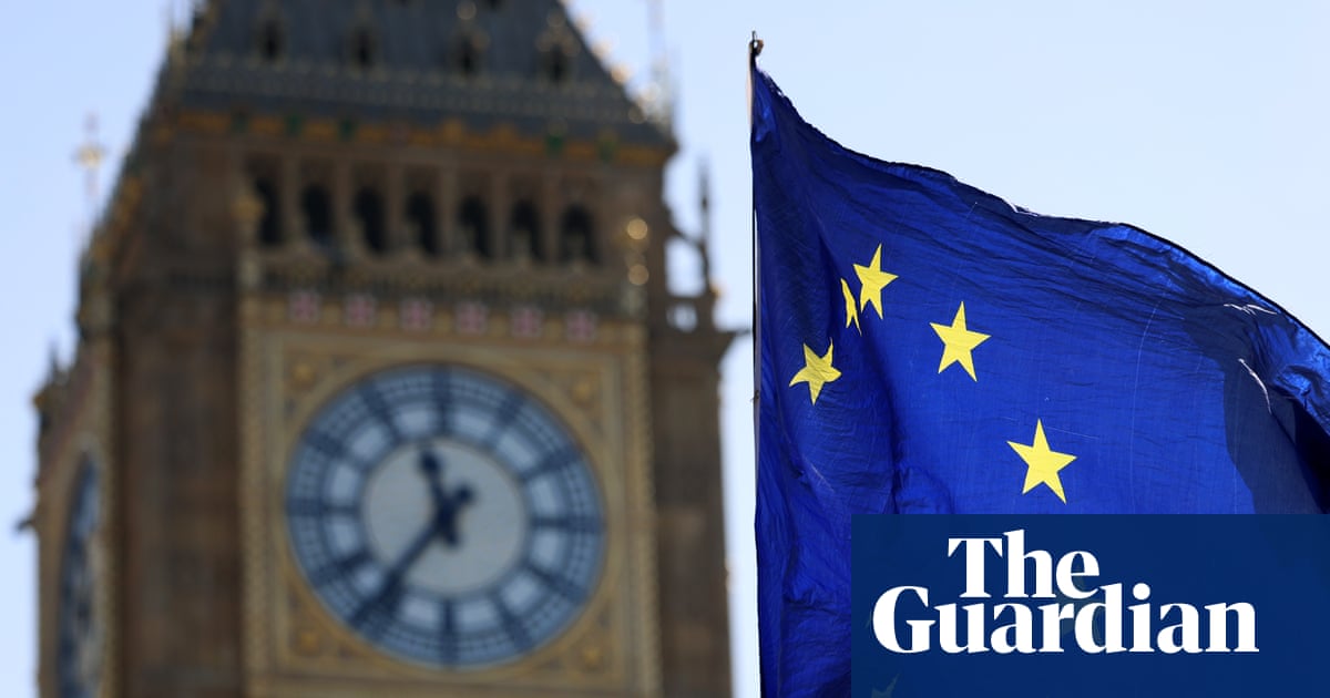 An EU flag flies in the wind outside Big Ben in London